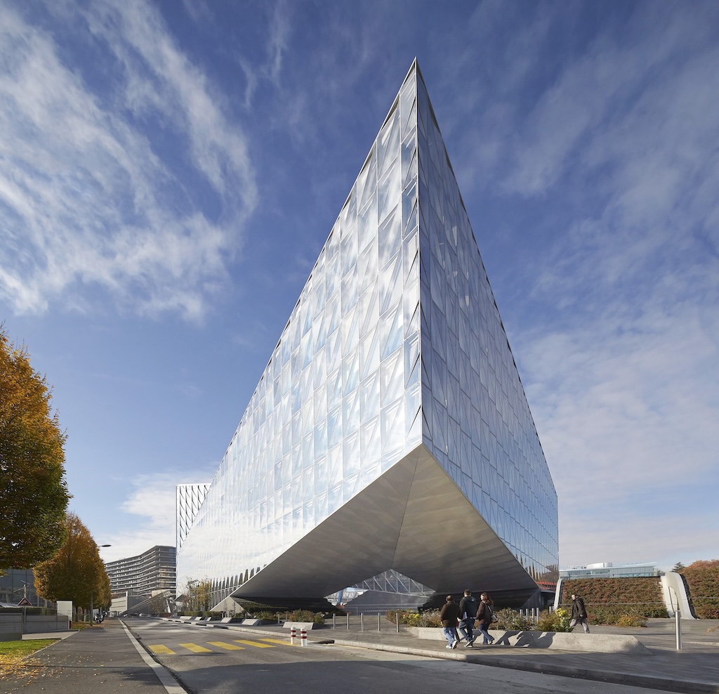 JTI Distinctive angular glass façade of JTI Headquarters in Geneva, designed by Skidmore, Owings & Merrill (SOM). Nicolas Delforge served as JTI’s in-house architect, overseeing design and construction.